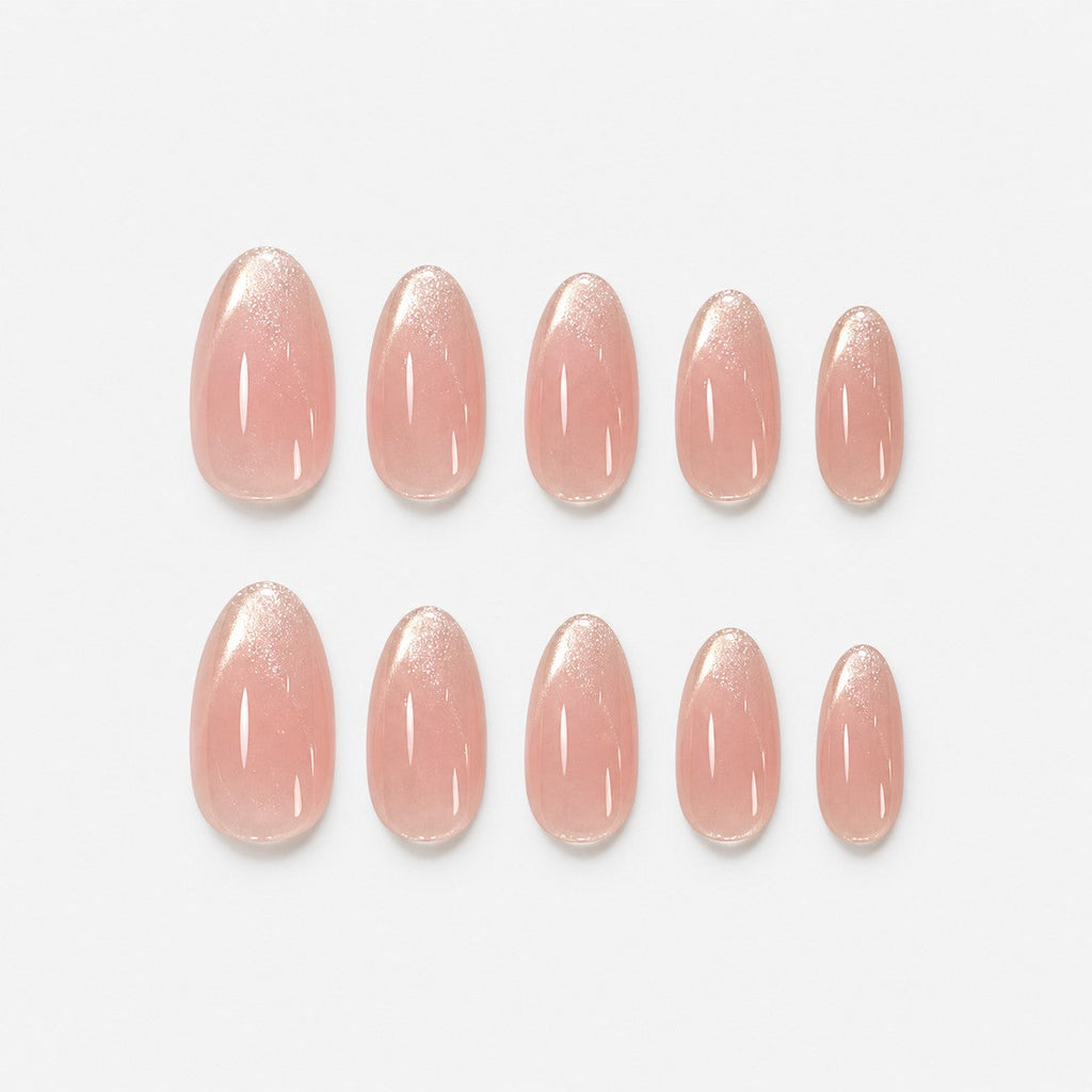 catalog: Short almond nails in sheer pink nude with glossy finish and shimmering pale champagne French tips.