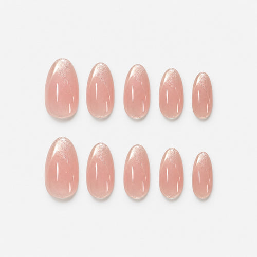catalog: Short almond nails in sheer pink nude with glossy finish and shimmering pale champagne French tips.