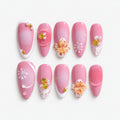 catalog: Almond medium press-on nails in rose pink with white tips, sculpted cream and apricot flowers, gold shell charms and pearls.