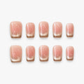 catalog: Short square press-on nails with a blush pink base fading into a shimmering champagne gold gradient tip.