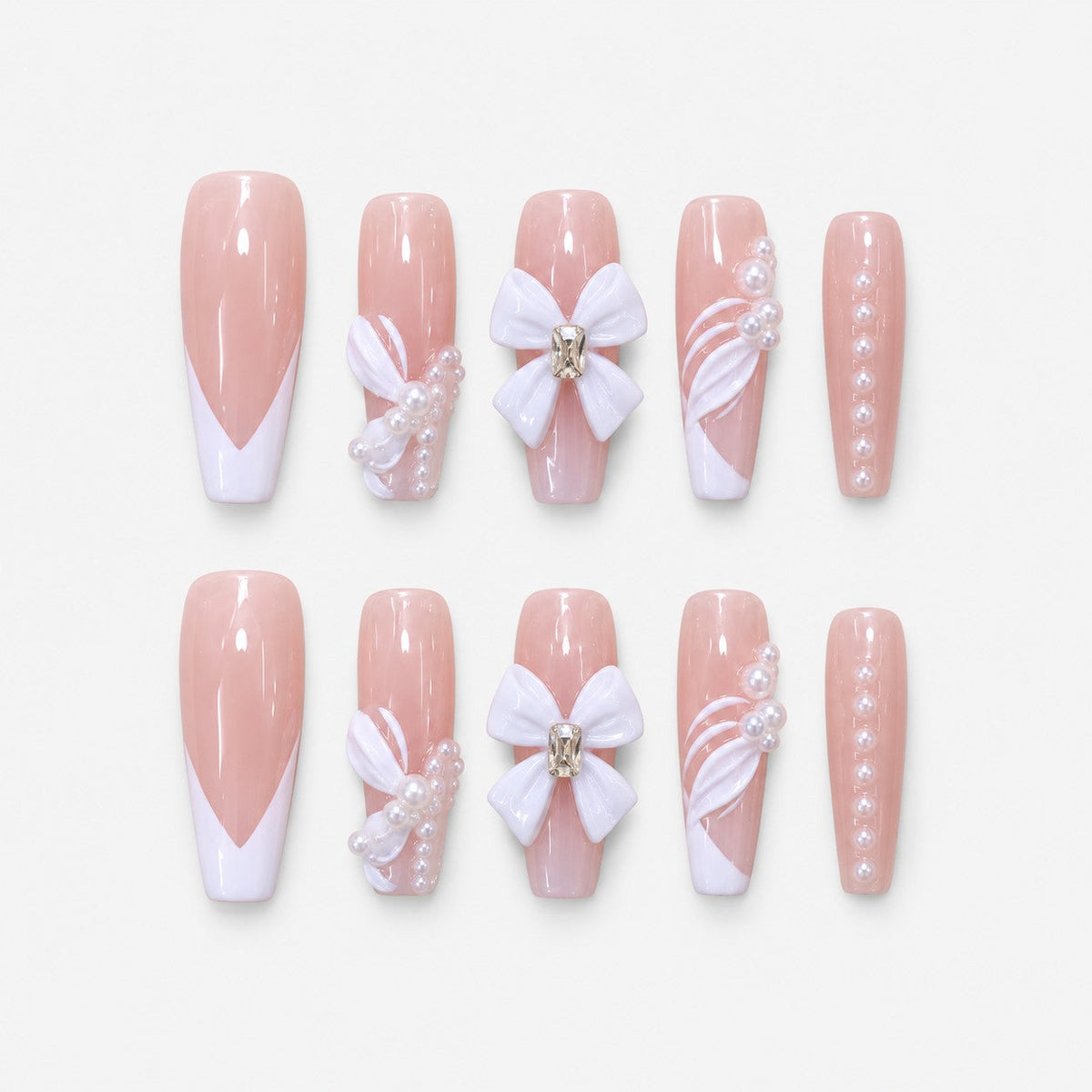 catalog: Long nude coffin nails with white French tips, a large white sculpted bow and rows of small pearls.