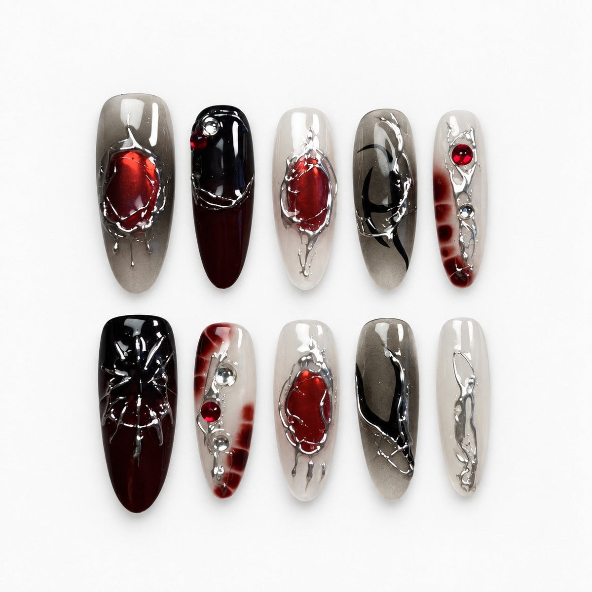catalog: Long almond press-on nails in smoky grey and black with red stones, silver chrome veins and a sculpted spider.