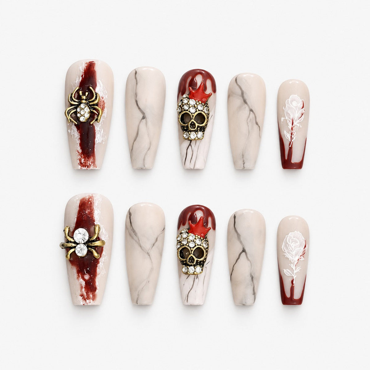 catalog: Long coffin press-on nails in nude and dark red with grey marbling, gold rhinestone spiders, jewelled skulls and painted white roses.