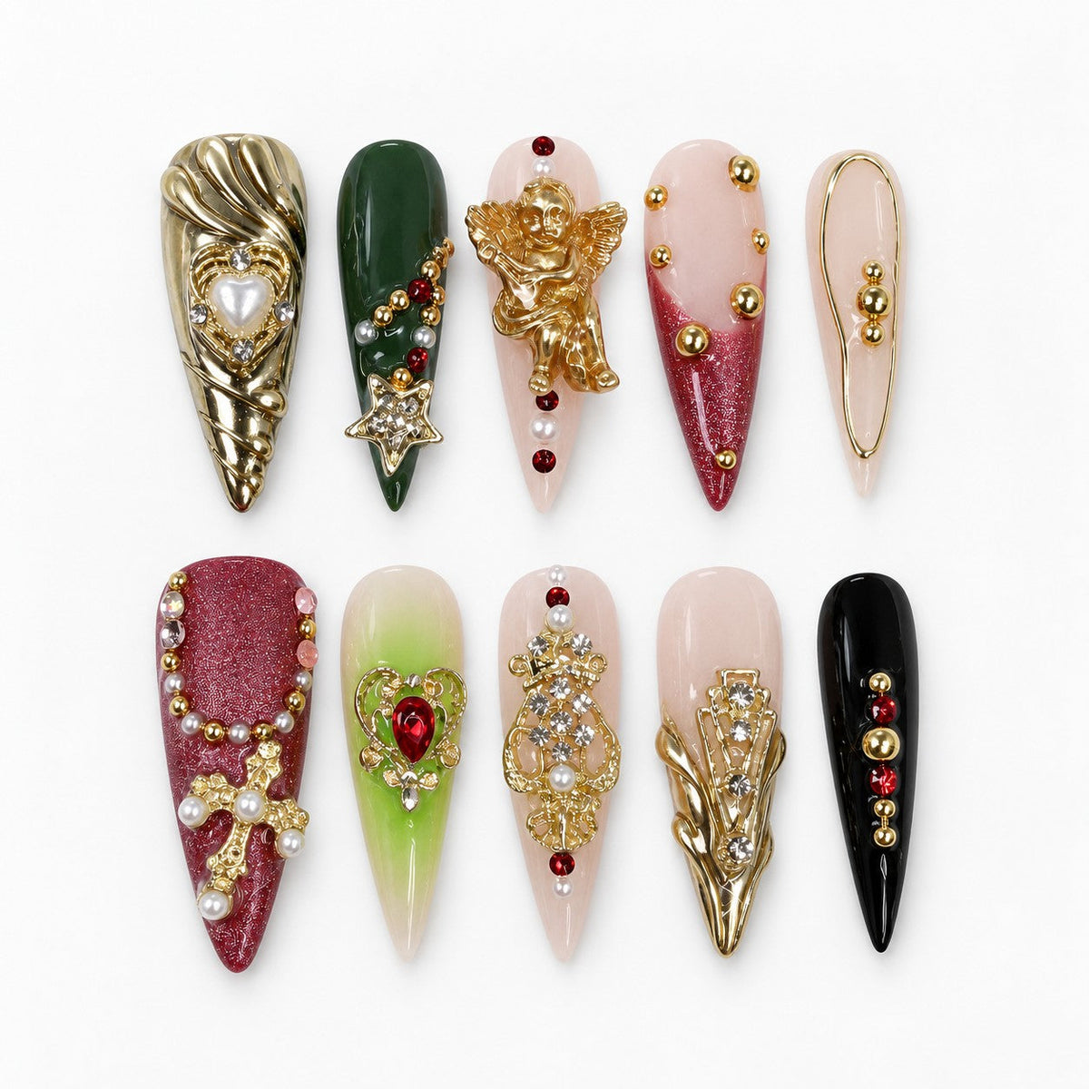 catalog: Long stiletto press-on nails in green, oxblood, nude and black with gold cherub, cross and crown charms, pearls and red crystals.
