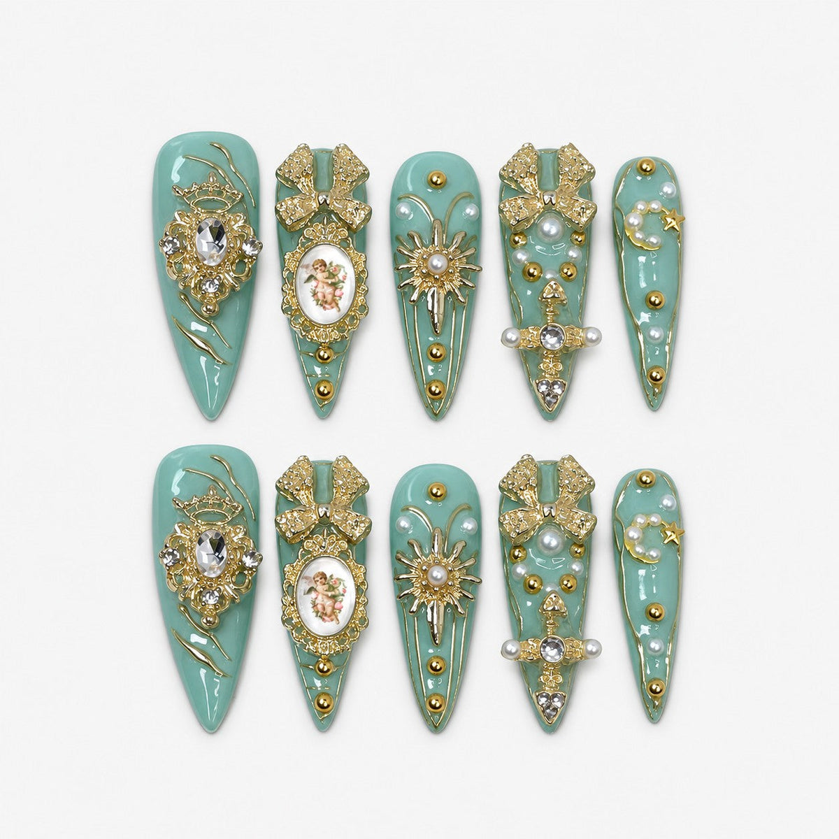 catalog: Long stiletto press-on nails in pale seafoam green with gold filigree, a cherub cameo, gold bows, clear stones and scattered pearls.