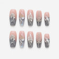 catalog: Long coffin press-on nails in smoky grey and clear with crushed silver foil and raised crystal shards.