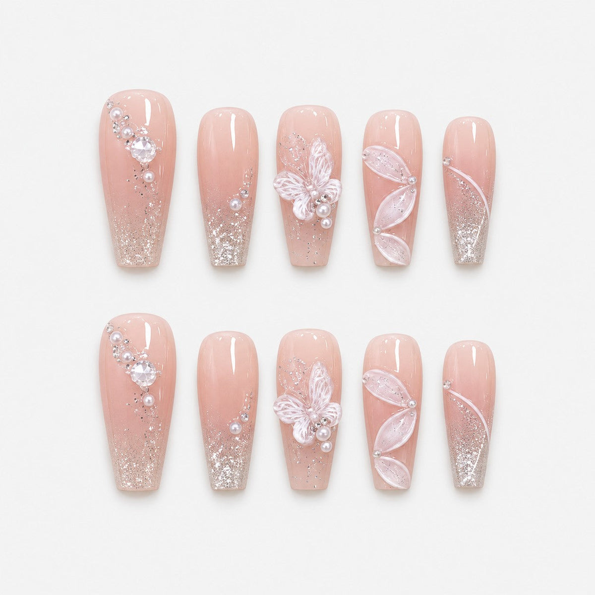 catalog: Long coffin press-on nails in sheer nude pink with silver shimmer, a sculpted white butterfly, sheer petal wings and small pearls.