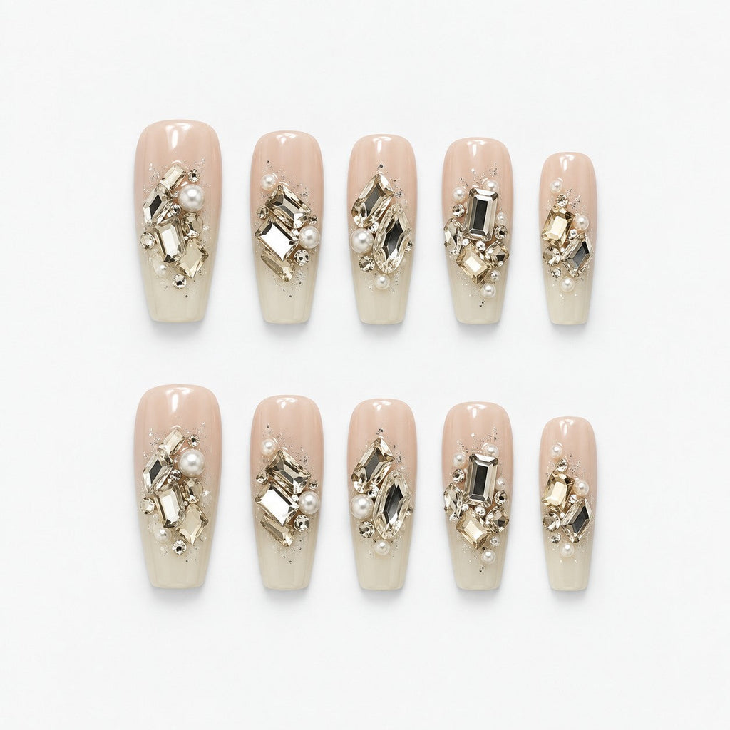 catalog: Long coffin press-on nails in sheer ivory with clusters of champagne and clear crystals, pearls and fine glitter.