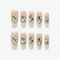 catalog: Long coffin press-on nails in sheer ivory with clusters of champagne and clear crystals, pearls and fine glitter.