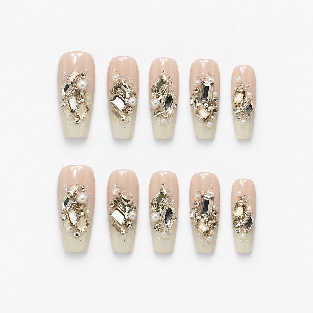 catalog: Long coffin press-on nails in sheer ivory with clusters of champagne and clear crystals, pearls and fine glitter.