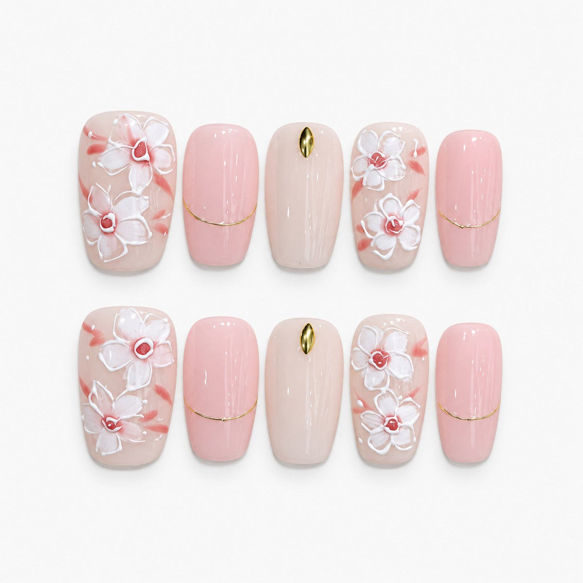 catalog: Medium square press-on set in milky pink with raised white magnolia flowers, coral brushstrokes and thin gold lines.
