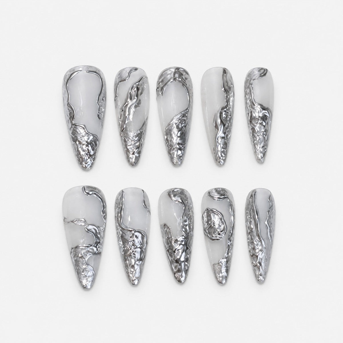 catalog: Long almond press-on nails in milky white with raised liquid silver chrome sculpted along the edges and tips.