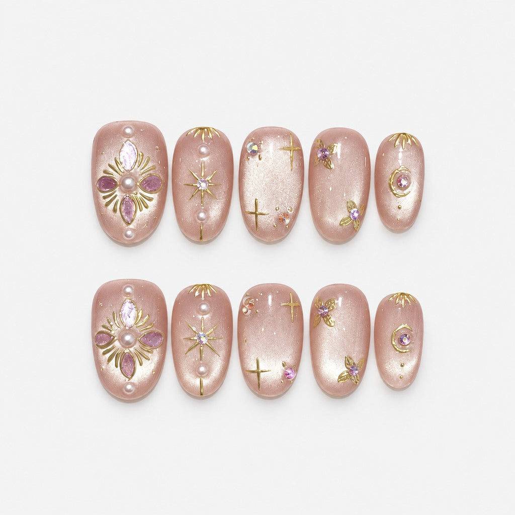 catalog: Medium almond press-on nails in shimmering pearly nude with gold star linework, pearls and a lilac gemstone flower.