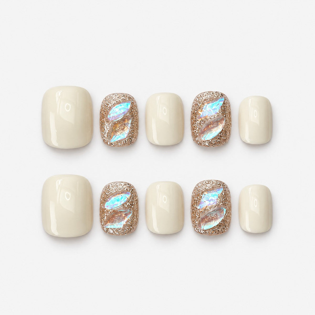 catalog: Short square nails in creamy off white with two rose gold glitter accent nails holding iridescent aurora shards.
