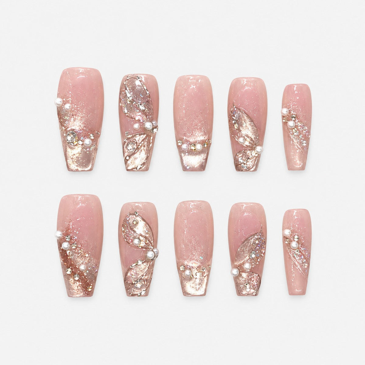 catalog: Long pink sheer nails with sculpted glitter petals, small pearls and rhinestones over a shimmering base.