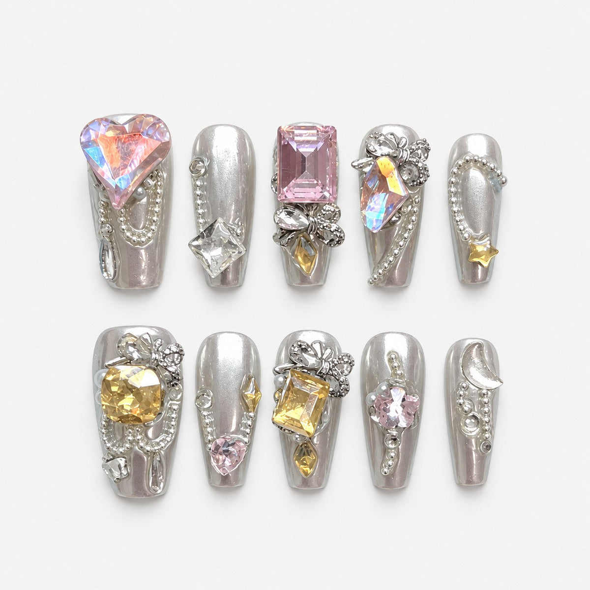 catalog: Long coffin nails in pearly silver set with iridescent heart and square gems, silver bead chains and rhinestone bows.