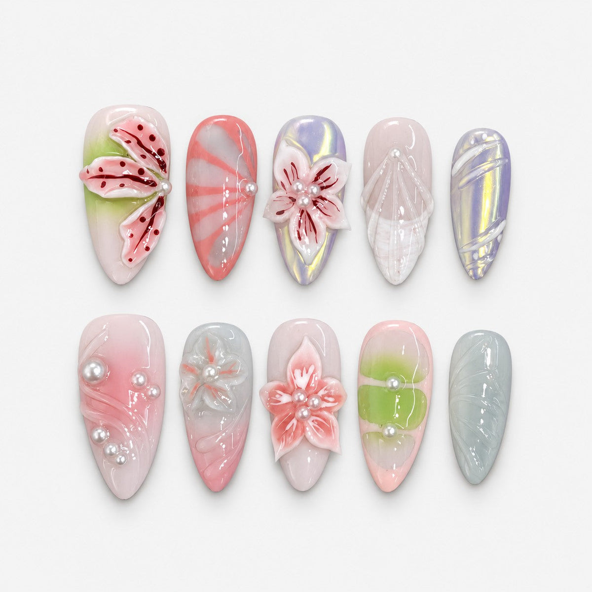 catalog: Long almond press-on nails in milky pink, green and grey with sculpted 3D lilies and blossoms, red painted petal veins and small white pearls.
