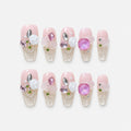catalog: Long pink and clear coffin nails with white sculpted roses, pink and lilac gems and small green beads.