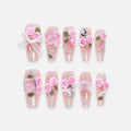 catalog: Medium coffin press-on nails with a clear pink glitter base, sculpted pink roses with green leaves, pearls and a white lace bow.