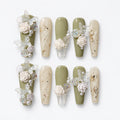 catalog: Long coffin press-on nails in sage green and milky white with hand-sculpted white roses, pearls and sheer butterflies, plus clear nails holding dried flower flecks.