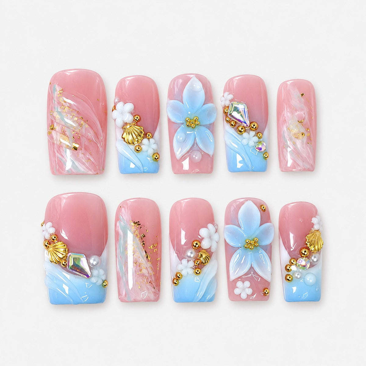 catalog: Medium square press-on nails in pink to blue gradient with sculpted white and blue flowers, gold shell charms, pearls and gold leaf marbling.