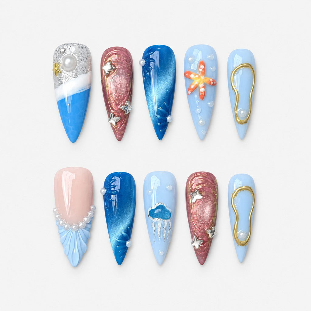 catalog: Long stiletto nails in ocean blue, pale sky and shimmering rose with a painted starfish, silver jellyfish, sculpted shells, gold outlines and ivory pearls.