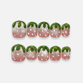 catalog: Short square press-on nails shaped like strawberries, pink shimmer bases with raised white seed dots and sculpted glossy green tops.