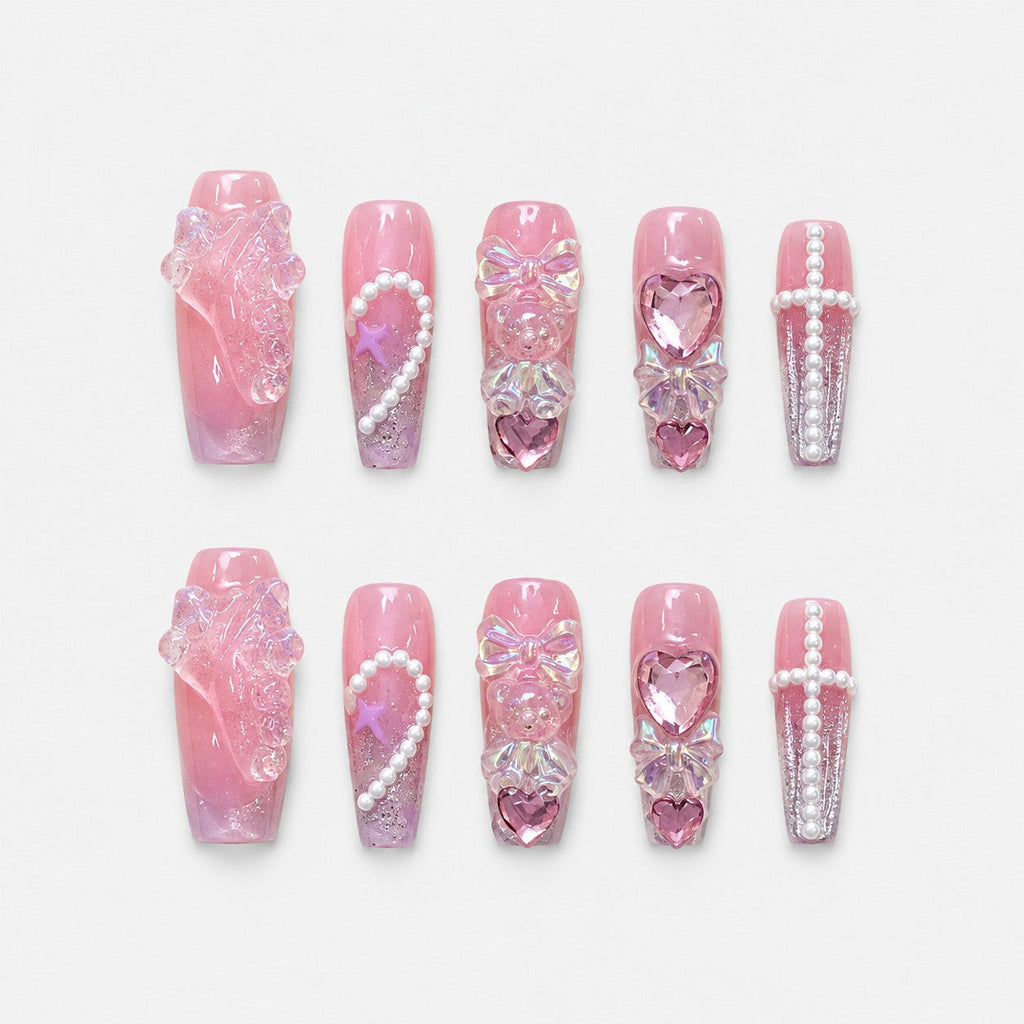 catalog: Long pink coffin nails with iridescent 3D bows, bear charms, glassy hearts and curved pearl strands.