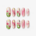 catalog: Medium oval nails with a milky pink base, hand painted pink tulips with green leaves and iridescent glitter flakes.
